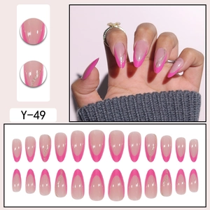 Pink almond press-on nails with luxury French tips and gold glitter wavy accents