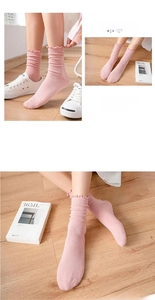 Detailed view of light pink ruffled knit crew socks with Japanese style layering effect