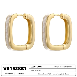 Detail of square gold brass hoop earrings with white enamel inlay 24mm size