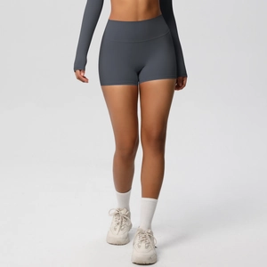 Detail view of high-waist charcoal yoga shorts with seamless compression and body contouring