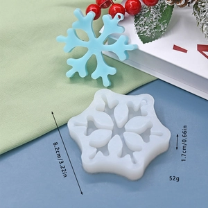 Detail view of snowflake silicone mold showing dimensions of 8.2cm diameter and 1.7cm thickness