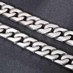 Detail of matte brushed and mirror polished stainless steel Cuban chain bracelet for men