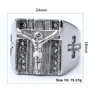 Macro view of silver religious crucifix ring with crystal accents and 24mm face width