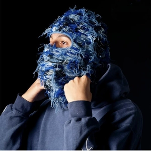 Detail of deep blue distressed denim knit balaclava showing street style texture