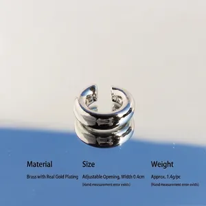 Minimalist silver-plated brass C-shaped ear cuff with a polished finish and adjustable design