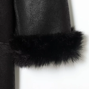Winter long faux fur coat for women with matte leather and plush cuffs in black