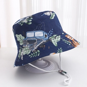 Detail of dark blue kids sun hat featuring cartoon animal prints and adjustable wind cord