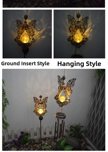 Solar angel garden lights with hollow iron wings and warm yellow crackle glass globe glow