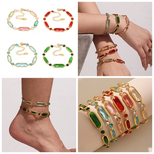 Detail view of colorful glass gemstones on a gold stainless steel adjustable bracelet