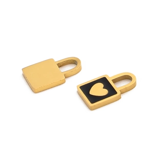 Detail view of golden lock charms with black enamel and heart pattern for jewelry making