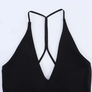 Detailed close-up of a black deep V-neck halter dress with thin Y-shaped back straps