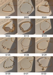 Detail showcase of vintage gold bracelets with pearls, charms, and intricate link designs
