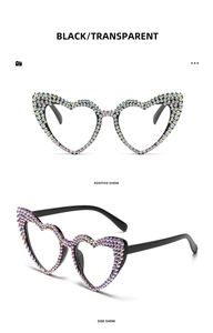 Detail of heart-shaped sunglasses with rainbow rhinestones and sturdy metal hinges