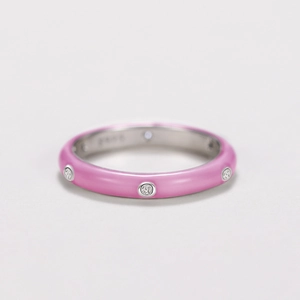 Detail of S925 silver stamp and pink enamel finish with inset clear zircon stones