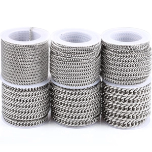 Polished silver stainless steel Cuban link chains on white spools in various sizes