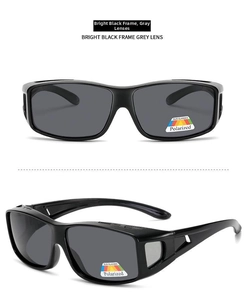Close-up of polarized sunglasses with bright black frame and grey lens for sports