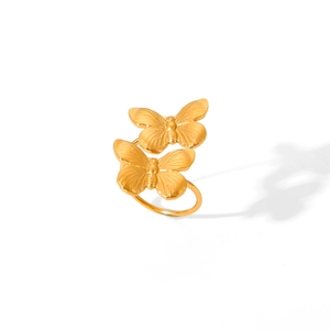 Elegant gold butterfly stainless steel ring with 3D layered wings on white background