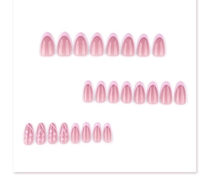 Close-up of pink almond press-on nails with white floral patterns and French design