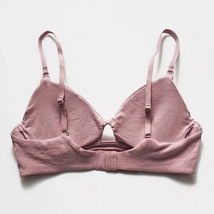 French style dusty pink ribbed wireless bra with adjustable straps in flat lay view