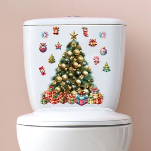 Christmas tree and gift box decals applied on a white toilet tank for holiday home decor