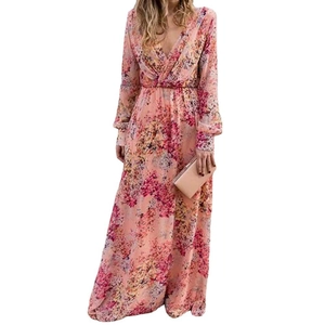 Detailed view of pink floral long dress with V-neckline and high waist pleated design