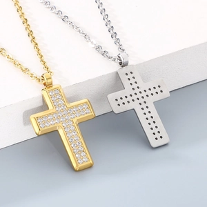 Gold and steel titanium cross pendant necklaces with pavé cubic zirconia inlay