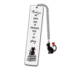 Detail of silver stainless steel bookmark with cat pendant and engraved thank you message