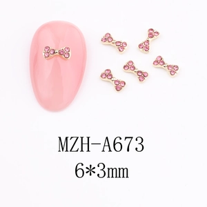 Pink rhinestone bow nail art charms with gold metal edges, 6x3mm decorative nail gems
