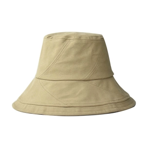 Detail view of khaki cotton bucket hat with distinctive diagonal stitching and crown structure