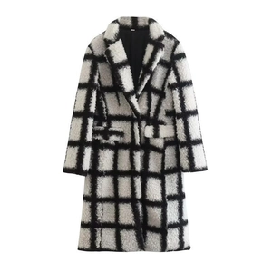 Detail of classic black and white plaid pattern on thick plush wool coat fabric