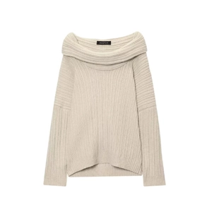 Detail of apricot off-shoulder knit sweater showing vertical ribbed texture and cowl neck
