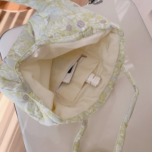 Floral quilted cotton tote bag in mint green featuring a spacious interior and zipper pocket