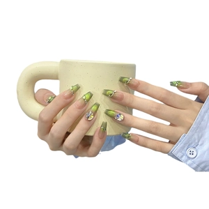 Green cat eye gradient press-on nails with luxury rhinestones on long coffin shape
