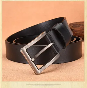 Close-up of premium black leather belt with a brushed silver metal pin buckle