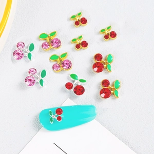 Charming cherry shaped nail art charms with red rhinestones and green leaves details