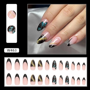 French press-on nails with black gradient, golden foil, and butterfly patterns