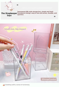 Close-up of clear acrylic desk organizer holding colorful markers on a pink desk