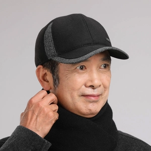 Detail of winter baseball cap for elderly men with warm ear flaps and thick wool fabric