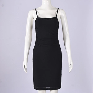 Close-up of black bodycon slip dress with spaghetti straps and pleated bust detail