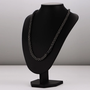 Vintage stainless steel braided chain necklace for men on a professional black bust display