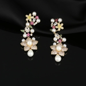 Exquisite gold floral drop earrings with white pearls and sparkling cubic zirconia