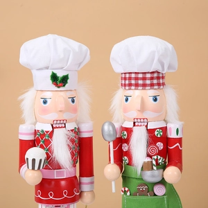 Set of 2 chef style wooden nutcracker figures with cupcake and gingerbread accessories