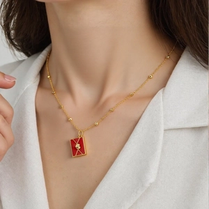 Chic 18K gold plated envelope pendant necklace with red enamel heart on a beaded chain