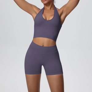 Close-up of seamless ribbed yoga set featuring halter neck top and high-waist biker shorts