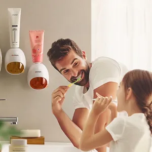 Automatic wall-mounted toothpaste dispenser for family use with cute spherical design