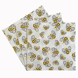 Single-sided printed paper napkins with yellow cartoon honey bee pattern on white background