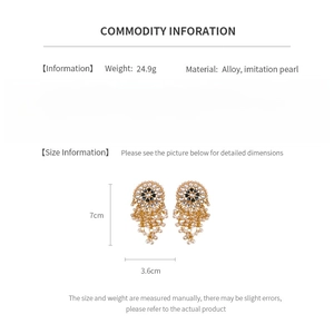 Detail showing vintage heart and pearl drop earring dimensions and material specifications