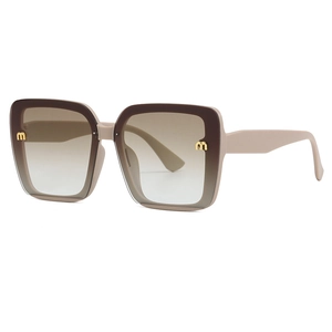 Oversized square beige sunglasses with gradient lenses and gold metal M logo accents