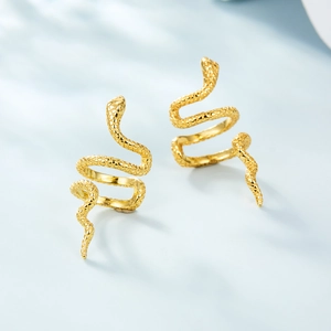 Macro detail of golden snake ear cuff with realistic scale texture on 925 silver