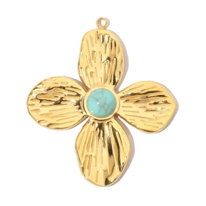 Macro detail of gold-plated four-leaf clover pendant with blue turquoise stone inlay